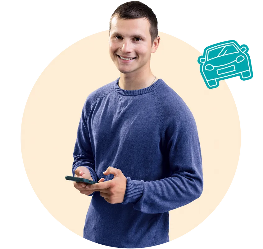 A young man in dark blue sweater holding a mobile phone