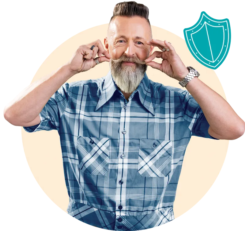 A middle-aged man with grey beard in a blue checked shirt, twiddling his moustache!